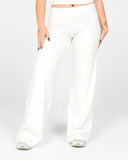 White wide-leg pants worn by a person on a white background