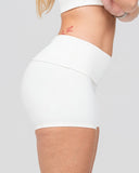 Person wearing a white athletic outfit on a light gray background